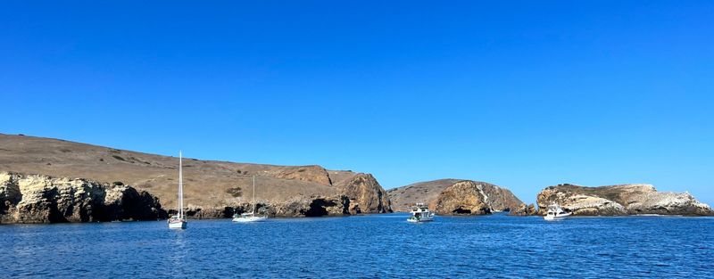Little Scoprion Anchorage as seen from the boat. We took this picture right after anchoring. By the time we made it to shore and hiked up the hills and took the first picture in this post, most of the boats had left.