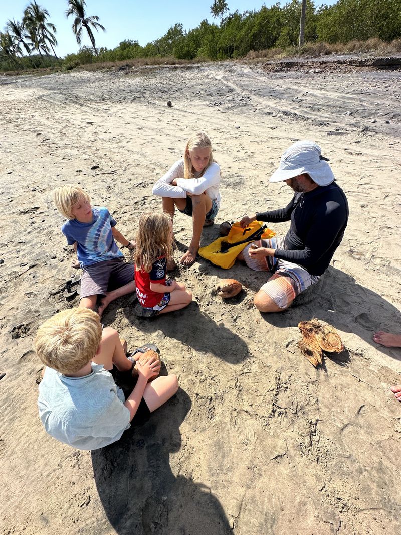 Learning how to gather coconuts and harvest their water and meat