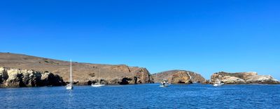 Little Scoprion Anchorage as seen from the boat. We took this picture right after anchoring. By the time we made it to shore and hiked up the hills and took the first picture in this post, most of the boats had left.