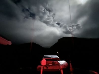 One last look at Cueva Valdez before lifting the anchor. The moon was out, coming in and out of the clouds.